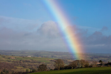 Rainbow over farmland and fields in County Durham, England, UK.