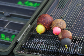 Carpfishing session at the Lake.Carp fishing hooks.fishing hooks are equipped with leashes for...