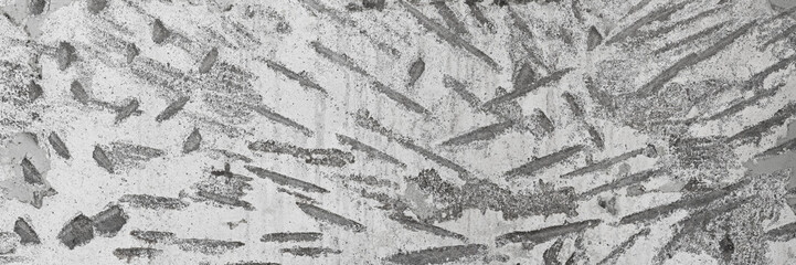 Texture of old concrete wall. Rough gray surface of concrete with a chaotic pattern of potholes and...