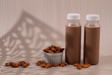 Chocolate flavored almond milk in a plastic bottle. made from almonds, chocolate, water and sugar. suitable for vegetarians and vegans as well as people who are allergic to cow's milk. susu coklat. 