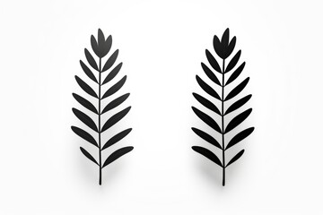 Two black leaves on a white background. Can be used as a minimalist and elegant design element
