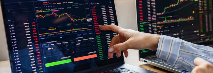 Woman Entrepreneur analysis graph stock market trading, stock chart, analysing datum and risks,...