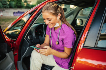 Waiting in car, nurse scrolls through social media on phone.