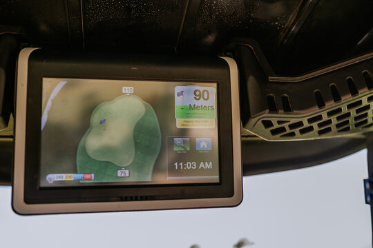 Sotogrande, Spain - January, 23, 2024 - Golf cart GPS showing hole layout and distance to green. - Powered by Adobe