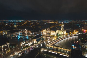Fototapeta na wymiar Luminous Tapestry: Mesmerizing Aerial View of a Vibrant Cityscape Illuminated by Night Lights