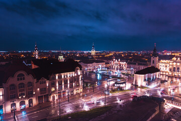 Midnight Symphony: A Captivating Aerial Glimpse of Oradea, Romanias Vibrant Cityscape Bathed in Moonlit Splendor