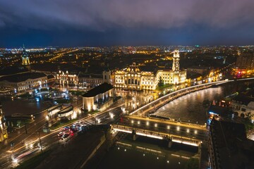 Fototapeta na wymiar Luminescent Tapestry of Oradea: A Captivating Aerial View of a Bustling Romanian City at Night.