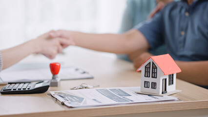 female realtor make property offer for sale to elderly spouses old customers contract on table,buy new home,take bank loan or medical health insurance concept.Financial advisor,realtor agent,insurance