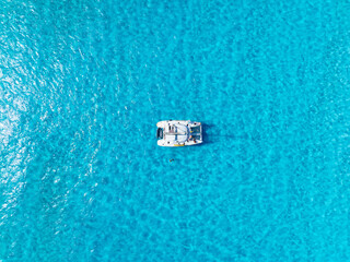 Drone view of a sailing yacht. Luxury transportation. Vacation and holidays. Summer time for sea travel. The sea bay. Photo for background and wallpaper.