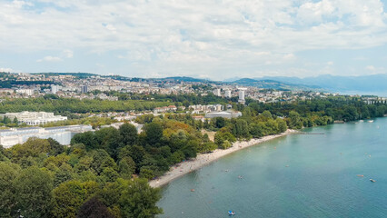 Fototapeta na wymiar Lausanne, Switzerland - July 16, 2023: The new building of the International Olympic Committee is located on the shores of Lake Geneva. Summer day, Aerial View