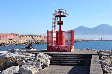 Fototapeta na wymiar Napoli - Faro sulla scogliera del Porticciolo del Molosiglio