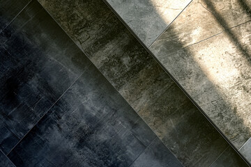 Abstract top view of old cement floor contrasting with sunlight.