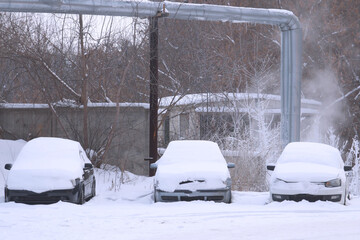 Cars covered with snow in the Parking lot