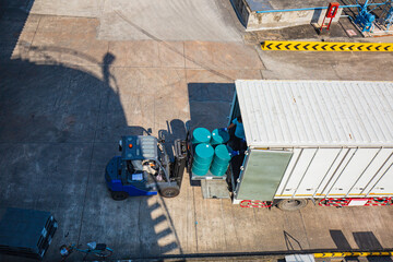 Oil barrels forklift truck move for on the transportation truck
