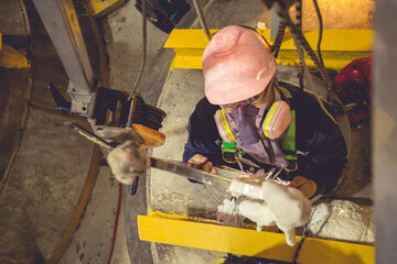 Top view male climb up the stairs into the tank stainless chemical area confined space save lives with rescue rope