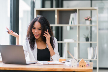 Professional African American businesswoman on a business call at workplace.