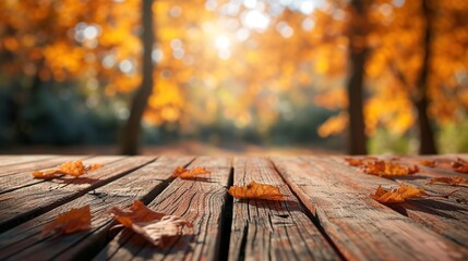 The wooden table top is vacant, and the autumnal background is blurry.