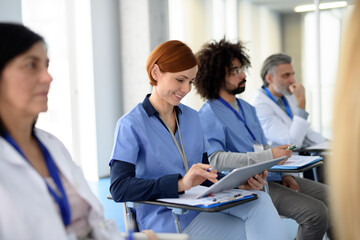 Group of doctors on conference, medical team sitting and listening speaker. Medical experts...