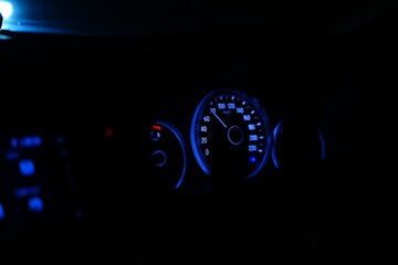 Speedometer and odometer in car console.