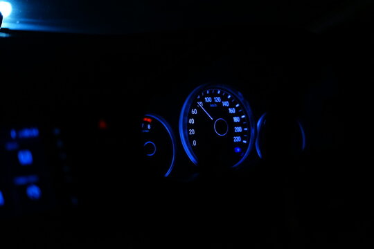 Speedometer and odometer in car console.