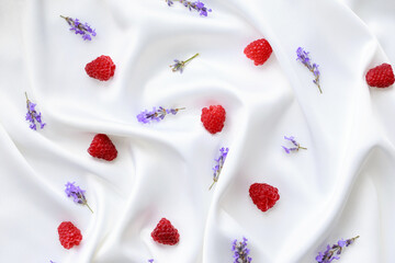 Scattered raspberries with lavender