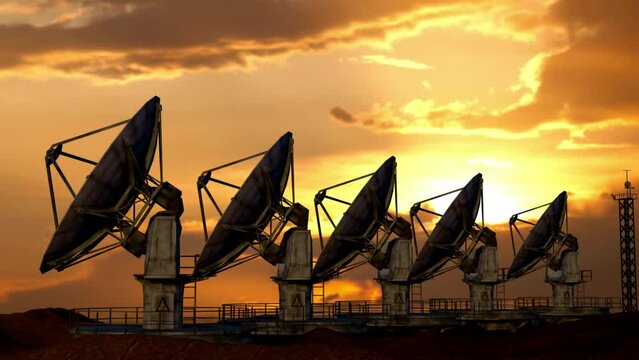 Big radar telescopes stations standing on the roof over sunset. Row of modern military telescopes radar dishes moving up and rotating.