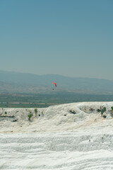 paragliding over the travertines in Pamukkale