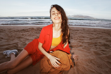 Fototapeta na wymiar Traveler's Bliss: Joyful Woman Relaxing on a Beautiful Beach, Embracing Freedom and Adventure
