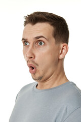 Fototapeta premium surprised guy looking at camera on white studio background