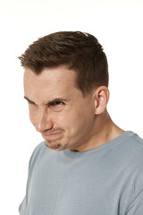 Obraz premium offended frustrated young man on white background. sadness