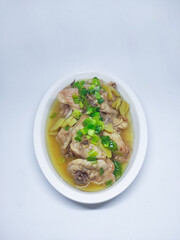 Steamed chicken meat with ginger served on plate isolated on white background