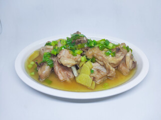 Steamed chicken meat with ginger served on plate isolated on white background