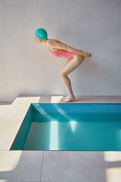 Young woman bending by hot tub at spa