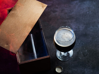 A gift beer bottle in a wooden box. A Father's Day gift. Craft Dark Beer Bottle