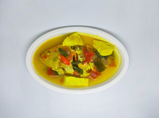 Tilapia fish in yellow sauce or Turmeric Tilapia Fish Soup, specifically for freshwater fish from...