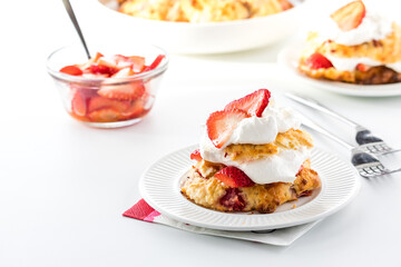 Obraz na płótnie Canvas Servings of fresh homemade strawberry shortcake, ready for eating.