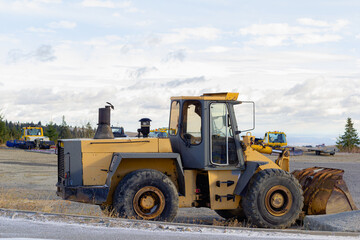 A large orange tractor for removing snow from the road. Snow clearing and clearing roads in the...