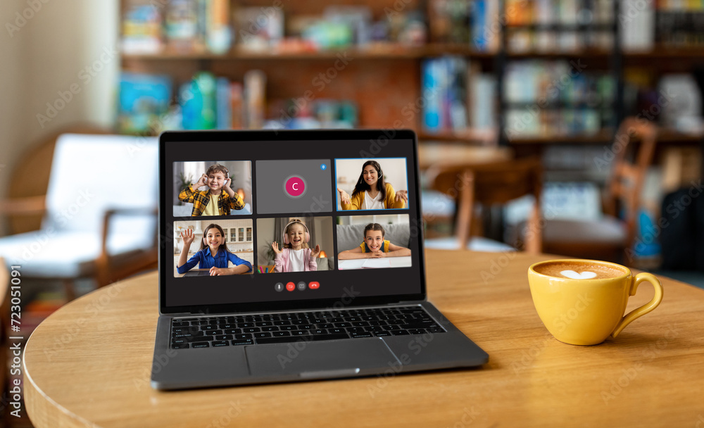 Poster laptop with video call online class screen on cafe table