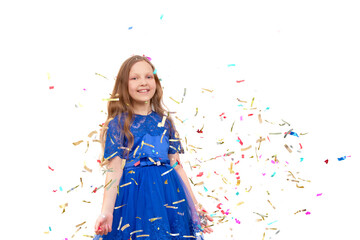 Little happy girl throwing colorful confetti on a white background.