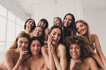 Photo of ten beautiful sisterhood touching face skin applying lotions in lingerie isolated at white studio background