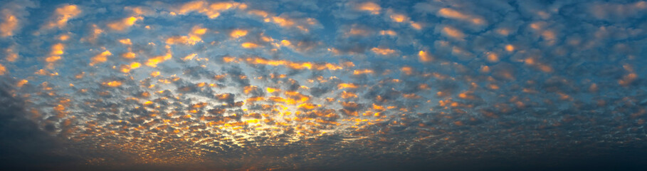 Panorama Fantasy clouds evening sunset.Panoramic of a twilight sunset and colorful clouds - sunlight with dramatic cloud.