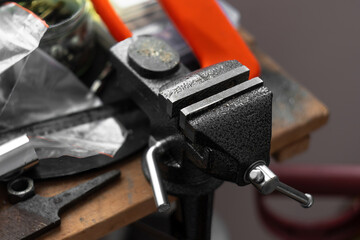 Small locksmith vices, clamps, for small household works. Workshop. Tools. Selective focus