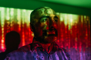 Digital code falling on mature man