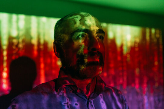 Digital code falling on mature man