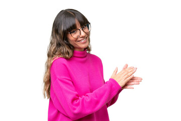 Young caucasian woman over isolated background applauding
