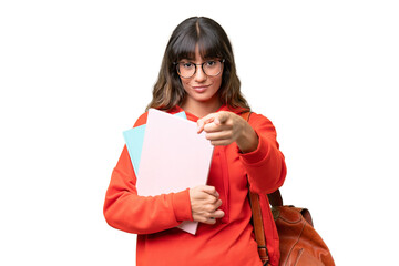 Young student caucasian woman over isolated background surprised and pointing front