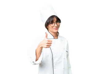 Young caucasian chef  woman over isolated chroma key background with thumbs up because something good has happened