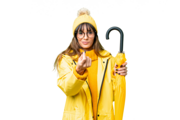 Young caucasian woman with rainproof coat and umbrella over isolated chroma key background making money gesture