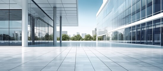 Horizontal view of empty cement floor with steel and glass modern building exterior. - obrazy, fototapety, plakaty