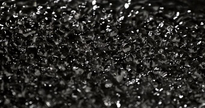 Super slow motion macro of abstract texture or background of energy magnetic field waves with water waving particles power at 1000 fps.